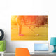 Golf player tee off at sunset Wall Decal