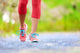 Jogging woman with athletic legs and running shoes Wall Decal