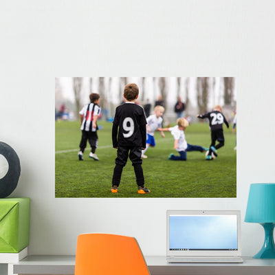 Action During Boys Soccer Match Wall Decal shown on a wall