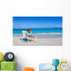 Little girl with laptop on beach during summer vacation Wall Decal