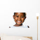 Extreme close up of small african girl showing teeth.T Wall Decal