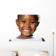 Extreme close up of small african girl showing teeth.T Wall Decal