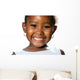 Extreme close up of small african girl showing teeth.T Wall Decal