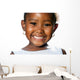 Extreme close up of small african girl showing teeth.T Wall Decal