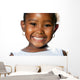 Extreme close up of small african girl showing teeth.T Wall Decal