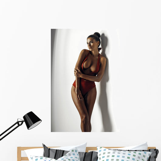 Girl in a red bathing suit Wall Decal