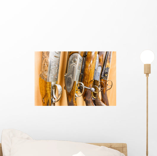 close up of a row of guns displayed in gun shop Wall Decal