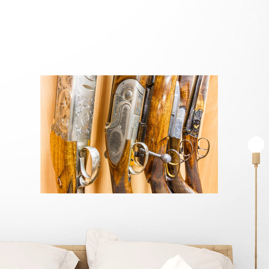 close up of a row of guns displayed in gun shop Wall Decal