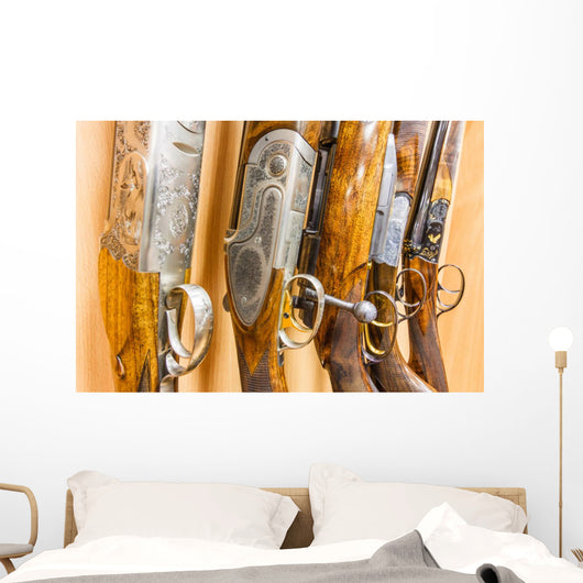 close up of a row of guns displayed in gun shop Wall Decal