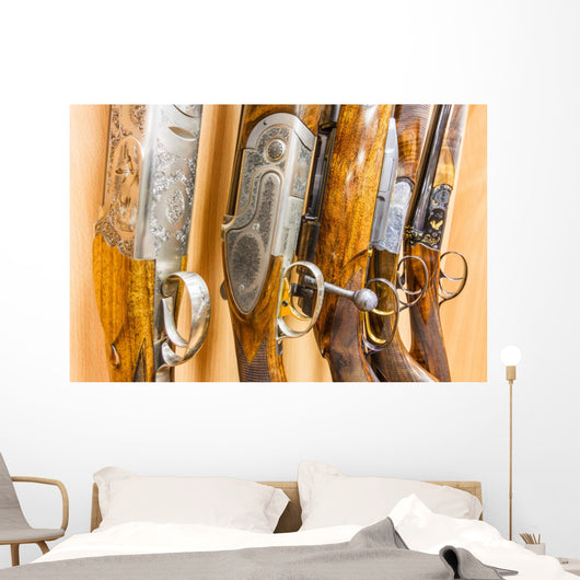 close up of a row of guns displayed in gun shop Wall Decal