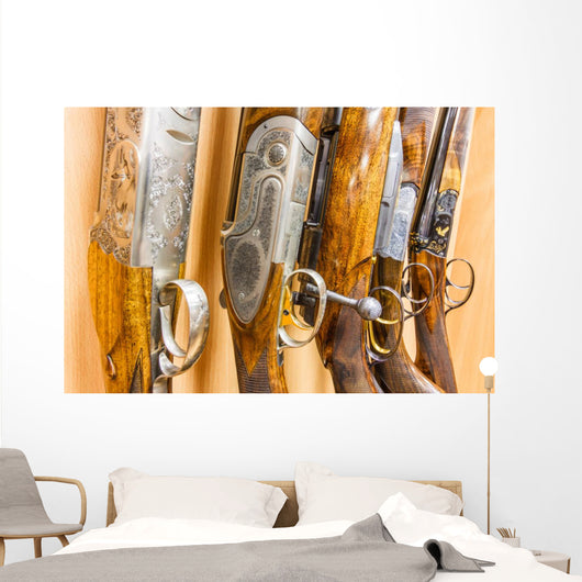 close up of a row of guns displayed in gun shop Wall Decal