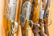 close up of a row of guns displayed in gun shop Wall Decal