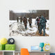 Group of hunters walking on the field in winter Wall Decal