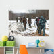 Group of hunters walking on the field in winter Wall Decal