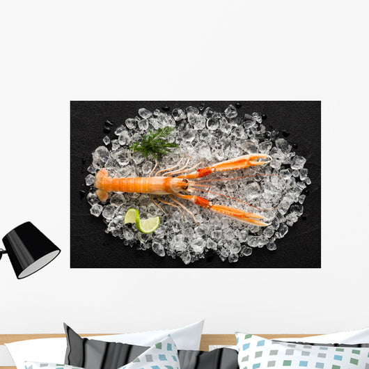 Fresh scampi shrimp on ice on a black stone table top view Wall Decal