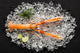 Fresh scampi shrimp on ice on a black stone table top view Wall Decal
