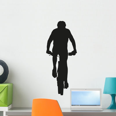 Mountain Biker Silhouette Wall Decal shown on a wall