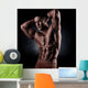 a young and fit male model posing his muscles Wall Decal