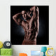 a young and fit male model posing his muscles Wall Decal