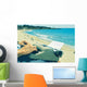 young man typewriting on the beach Wall Decal