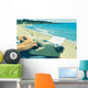 young man typewriting on the beach Wall Decal