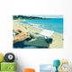 young man typewriting on the beach Wall Decal