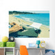 young man typewriting on the beach Wall Decal