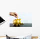 Putting coin into piggy bank Wall Decal