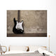 Black guitar near the wall Wall Decal