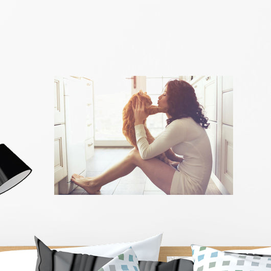 Girl playing with cat Wall Decal