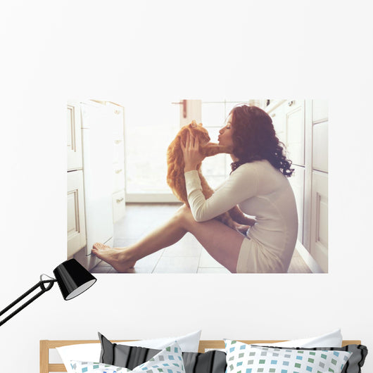 Girl playing with cat Wall Decal