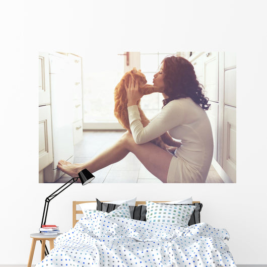 Girl playing with cat Wall Decal