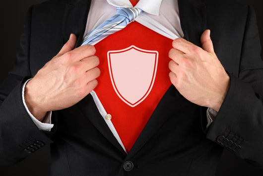 Businessman Showing A Shield Symbol Wall Decal