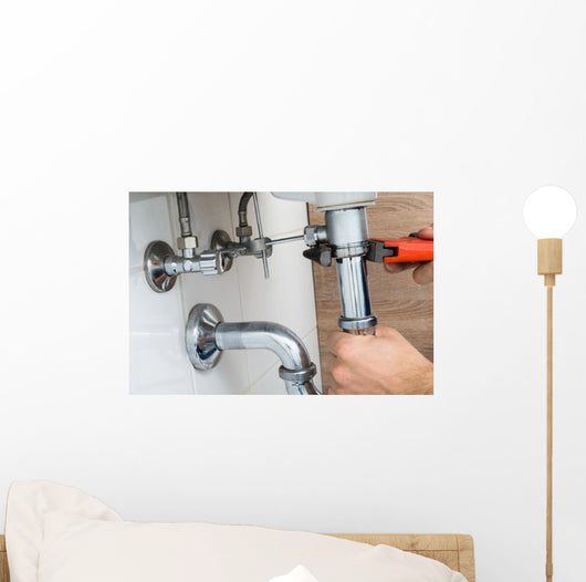 Male Plumber Fixing Sink In Bathroom Wall Decal