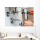 Male Plumber Fixing Sink In Bathroom Wall Decal