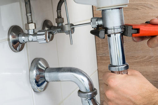 Male Plumber Fixing Sink In Bathroom Wall Decal