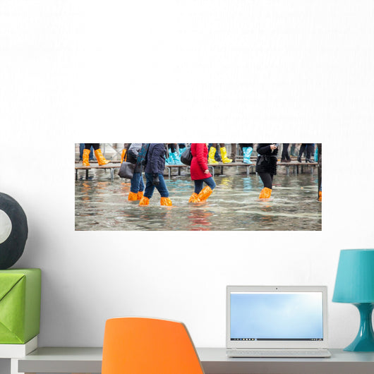Close Up of legs with boots due to the high water in Venice. Wall Decal