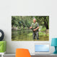 Cheerful mature fisherman fishing in a river Wall Decal