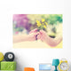 Elderly and young woman holding flowers outside Wall Decal