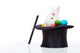 Cute white rabbit with colorful easter eggs in magician hat Wall Decal
