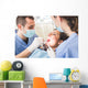 Dentist and Dental Assistant examining Patient teeth. Wall Decal