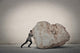 Businessman pushing a boulder Wall Decal