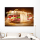 Sandwich with bacon and fresh vegetables on vintage wooden cutti Wall Decal
