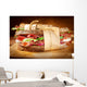 Sandwich with bacon and fresh vegetables on vintage wooden cutti Wall Decal