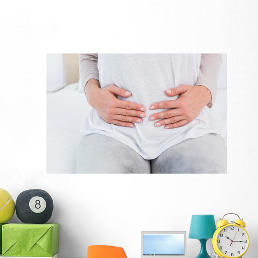 Mid section of woman with stomach pain Wall Decal