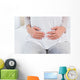 Mid section of woman with stomach pain Wall Decal
