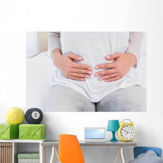 Mid section of woman with stomach pain Wall Decal