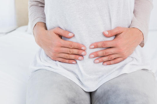 Mid section of woman with stomach pain Wall Decal