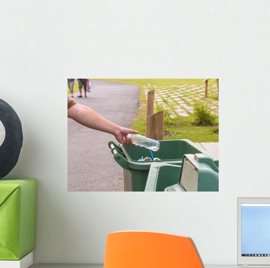 Hand throwing bottle in trash cans Wall Decal