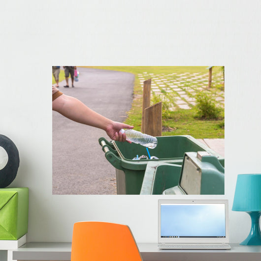 Hand throwing bottle in trash cans Wall Decal